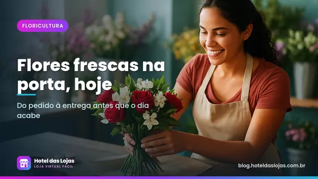 Florista monta buquê de rosas vermelhas e flores brancas em bancada de madeira com papel kraft e fitas