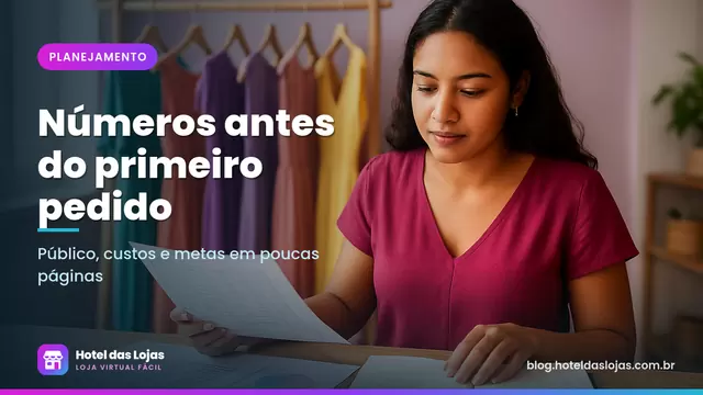 Empreendedora revisa planilhas impressas e gráficos desenhados à mão em ateliê de moda com arara de vestidos